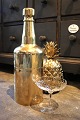 Old champagne 
cooler in the 
shape of a 
large bottle in 
...