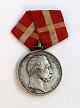 Medal for the 
rescue of 
drowning 
people. 
Christian X. 
Engraved name 
unclear.