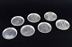 Just Andersen, 
Denmark.
Set of seven 
pewter bottle 
coasters 
engraved with 
motifs from 
Denmark. ...
