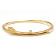An oval 18kt 
gold 
"Snakes"-bangle 
by Ole 
Lynggaard, 
Copenhagen
Size inside: 
5,9x4,8cm