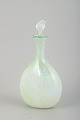 Danish 
contemporary 
glass artist. 
Decanter with 
stopper. 1990.
Mouth-blown 
decanter in 
clear ...