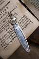 Old bookmark in 
silver 
(stamped) 
Length 8.5cm. 
with bird motif 
and text 
"Texel" which 
is the ...