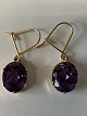 Earrings with purple stone in 14 carat gold.
Length 2.8 cm.