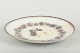 GeflePlate “Mullbär” with putti figures, c. 1880/90s.Round faience plate with relief ...