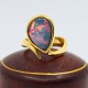 Georg Jensen; 
Ring in 18k 
gold set with a 
large opal