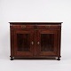 low antique 
sideboard from 
the 1880s, made 
of 
hand-polished 
mahogany. The 
sideboard is 
furnished ...