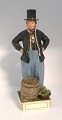 Royal Copenhagen. Overglaze figure Jan Hansen Schmidt Market costume, Amager. 
Model 12103. Height 32 cm. (1 quality)