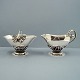 Georg Jensen; A 
set with sugar 
bowl and 
creamer of ...