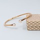 Bernhard Hertz; 
A bangle of 8k 
gold, set with 
two pearls.
Inner 
measures: 6,1 
cm x 5,1 ...