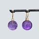 Ole Lynggaard a pair of earrings in 18k gold with amethyst and diamonds. a total of 0.10 ct. TW ...