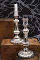 A pair of 19th 
century 
candlesticks in 
poor man's 
silver ...