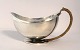 Georg Jensen. 
Sauce bowl with 
handle. Harald 
Nielsen. Model 
761. Length 17 
cm. Height 7.5 
cm. ...