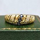 Ring in 14k 
gold set with 
sapphires and 
diamonds