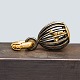 Ole Lynggaard; 
Sweet drops 
charm in 18k 
gold, birdcage