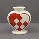 Royal 
Copenhagen red 
christmas heart 
in faience. 
With space for 
a candle and 
two branches. 
H. ...