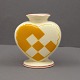 Aluminia yellow 
christmas heart 
in faience. 
With space for 
a candle and 
two branches. 
H. 7.5 cm. ...