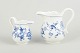 MeissenTwo creamers, “Blue Onion”, c. 1900.Two porcelain cream jugs in Meissen’s classic ...