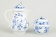 MeissenSugar bowl and demi-tasse pot, c. 1900.Hand-painted porcelain from Meissen’s iconic ...