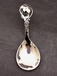 Silver serving spoon with grape motif