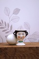 Old egg cup from the 1930s in porcelain with a painted funny face. Height: 6cm.