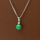 A necklace in 14k white gold set with diamond and jadeite