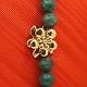 Charlotte Lynggaard for Ole Lynggaard; Flower clasp of 18k gold, set  with a diamond,Diam. 2.3 ...