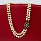 Pearl necklace with a 14k gold clasp, set with emerald ...