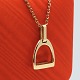 Ole Lynggaard; Stirrup pendant in 14k gold