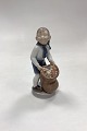 Royal Copenhagen Monthly Figurine December - Boy with Christmas Sack No. 4534. Designed by Hans ...