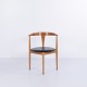 Armchair designed by Vilhelm Wohlert and made in oak with a black leather seat from the 1960s. ...