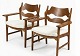 A pair of Razorblade armchairs by Henning Kjaernulf ...