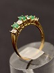 14 karat gold ring size 53 with clear and emerald colored stones item no. 639743
