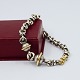 Peter Rauff; Bracelet in sterling silver and 18k gold.  L. 19.5 cm.  The bracelet can be ...