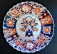 Japanese Imari dish, 19 years old. With wavy edge. Polychrome hand painting. Dia.: 28 cm.Great ...