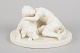 Gustavsberg, biscuit figure.Fine biscuit porcelain figure depicting a child embracing a dog. ...