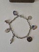 Vintage silver bracelet with 7 charmsStamp: SterlingLength 19 cm. Width 4 mm.Weight 11.7 ...