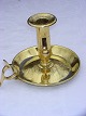 Brass 
candlestick, 
repair with 
pewter, on the 
bowl. Height 11 
cms. Width 16 
cms.