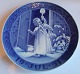 Royal 
Copenhagen 
Juleplatte 
(Kongelig, kgl) 
fra 1951 "Angel 
holding a 
candle opens a 
door". ...