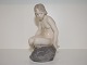 Royal 
Copenhagen 
Figurine, nude 
girl on rock.
The factory 
mark tells, 
that this was 
produced ...