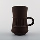 Jens H. Quistgaard, Flamestone.Nine coffee / mocha cups with saucers.