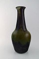 Daum Nancy, France. Colossal art deco vase in mouth-blown art glass in green and brown shades. 1930 / 40s.