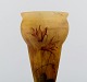 Daum Freres, Verrerie de la belle etoile, Croismare, Lysiés. Fuchsia vase in mouth blown art glass with flowers. Dated 1925-30.