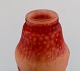 Daum Nancy, France. Large "Tobacco flowers" multilayer glass vase with an etched decor of red flowers on a yellow-orange and pink background. Early 20th century. Museum quality.