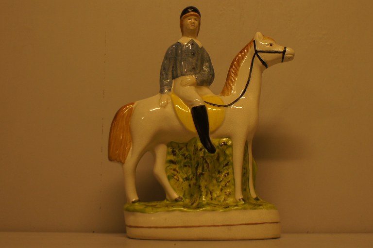 19 c. Staffordshire rider on horse.