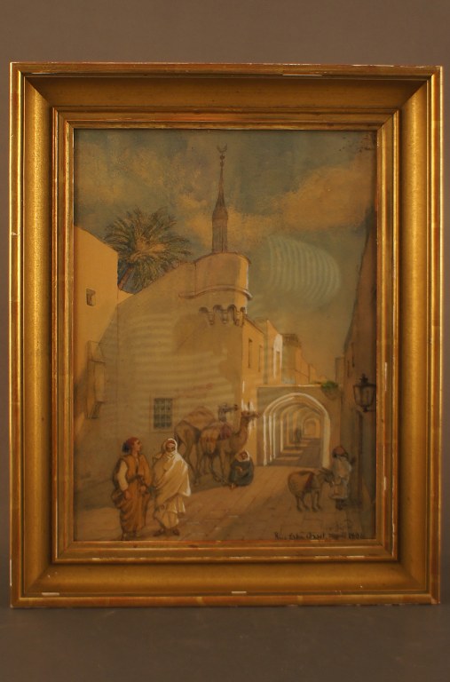 Antique watercolor, oriental street scene from Tripoli with people and camels. 
Indistinctly signed in monogram, Rue Erba Arset, Tripoli 1884.