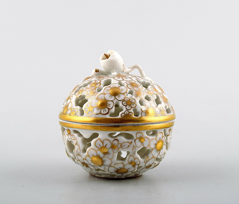 Herend lidded vase decorated with gold, porcelain.
