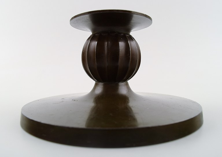 Just Andersen light bronze candlestick.
