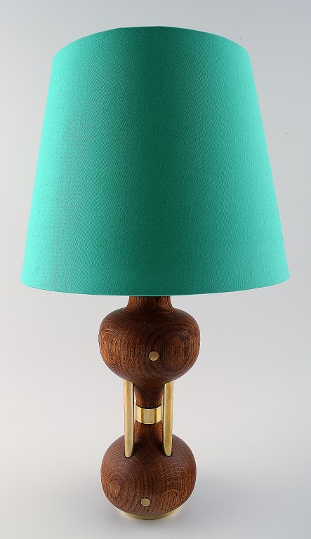 Danish design table lamp oak with brass details.
