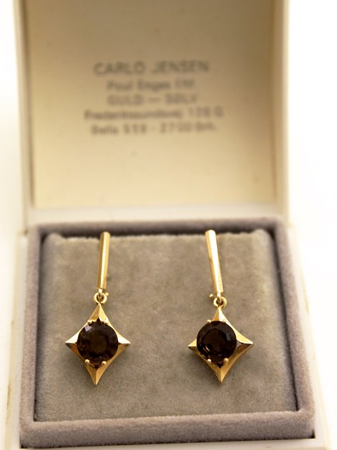 14 carat earrings with topas sold