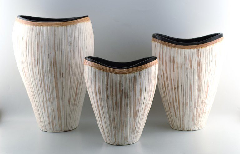 3 large modern pottery vases, light glaze and wickerwork.
